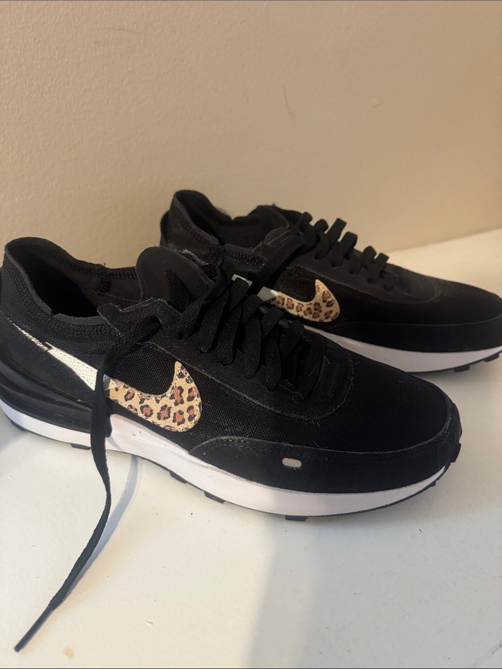 Nike Black Women's Sneakers with Leopard Swoosh Accent